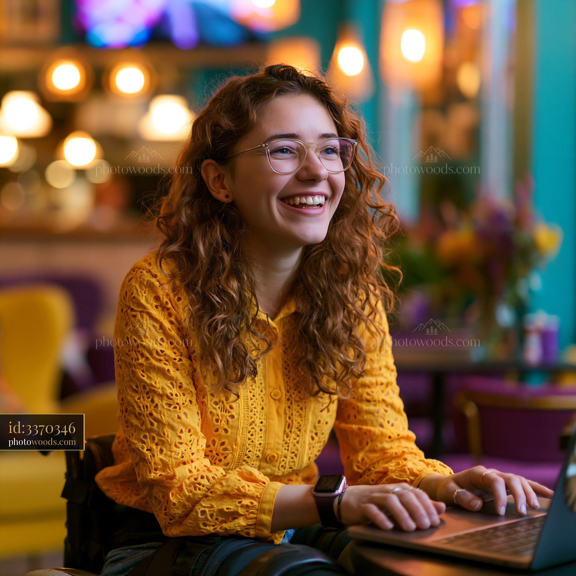 Laughing Student Using Laptop in Cafe With Bright Colors