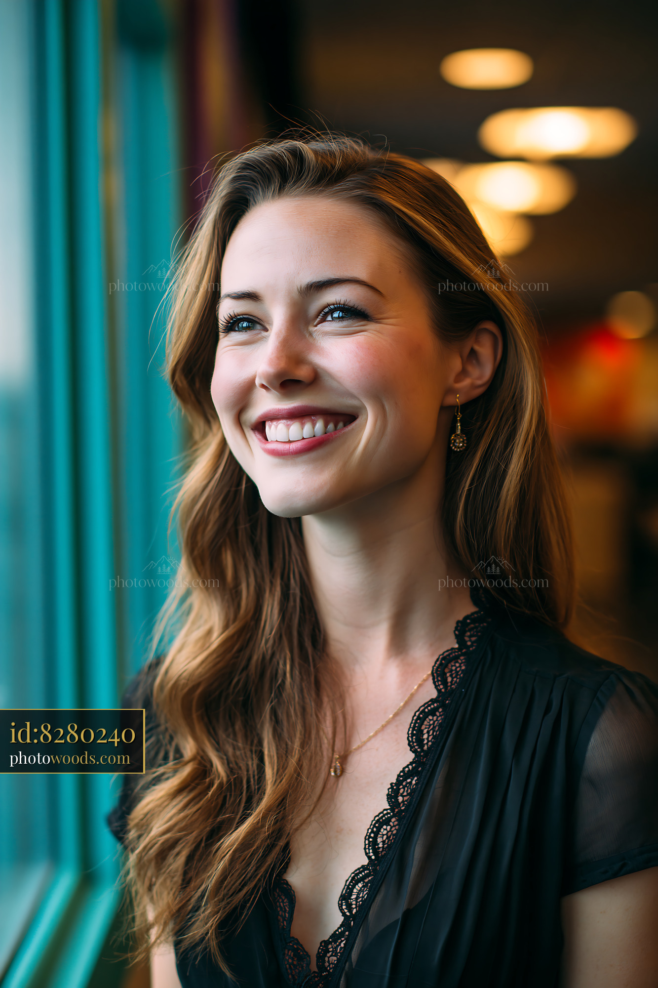 Woman Smiles While Looking out the Window in a Casual Setting