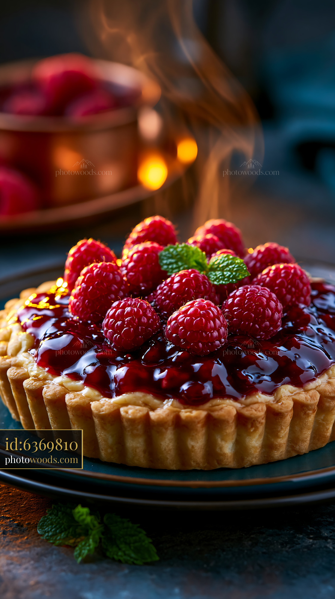 Berry Tart With Raspberry Glaze and Mint Leaves