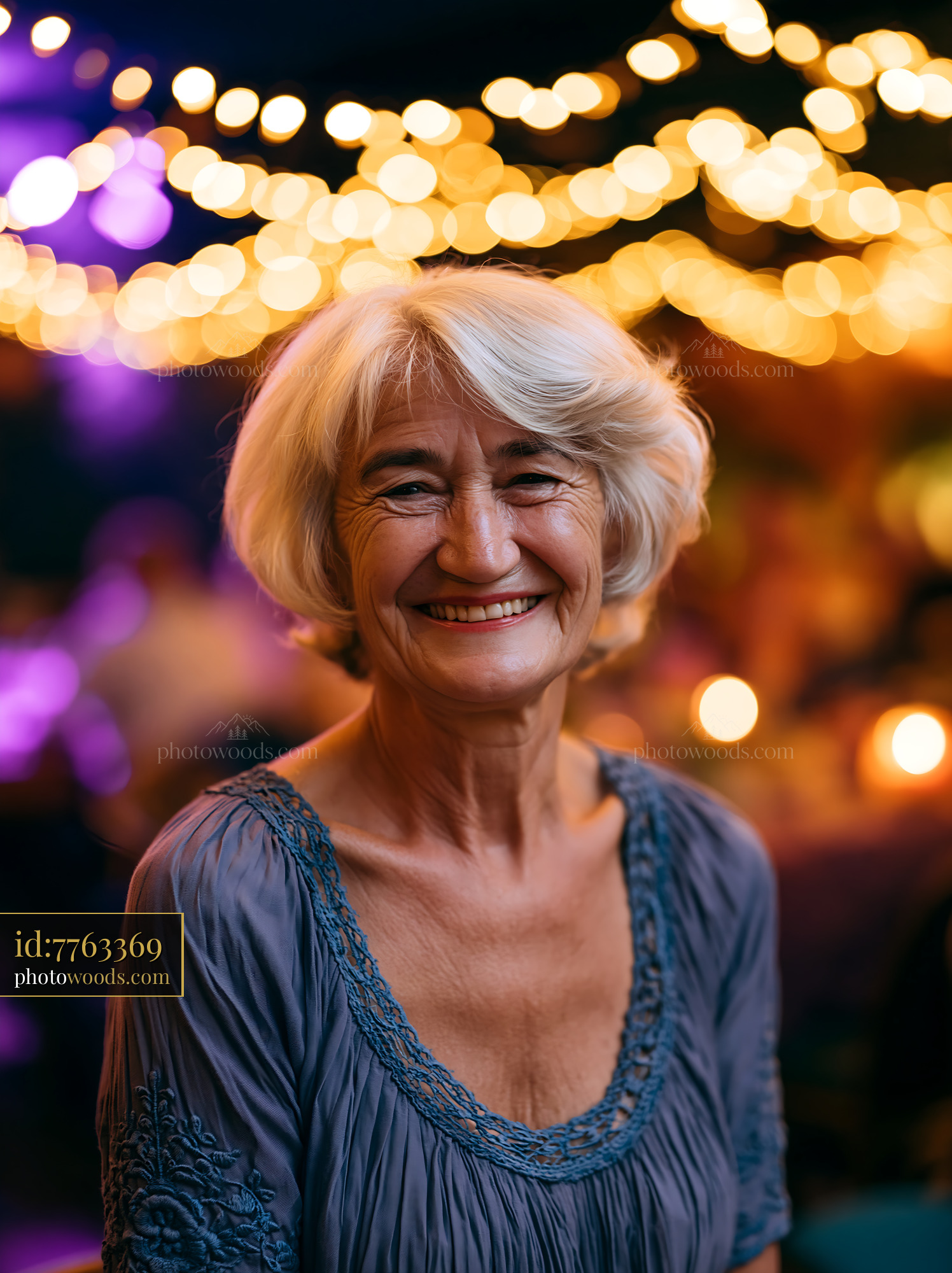 Elderly Woman Smiles Warmly Under Bright String Lights