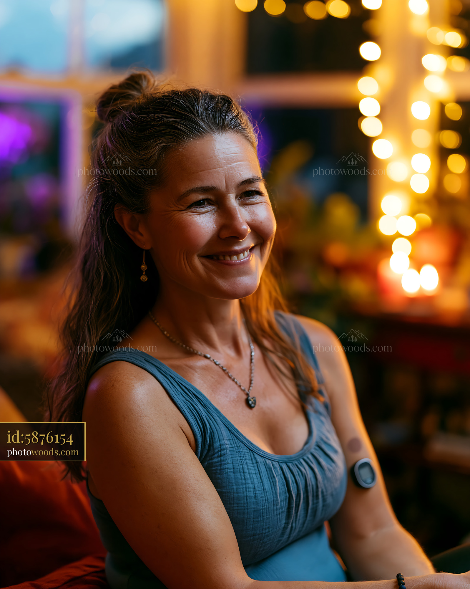 Runner With Glucose Sensor Enjoying Social Setting in Evening