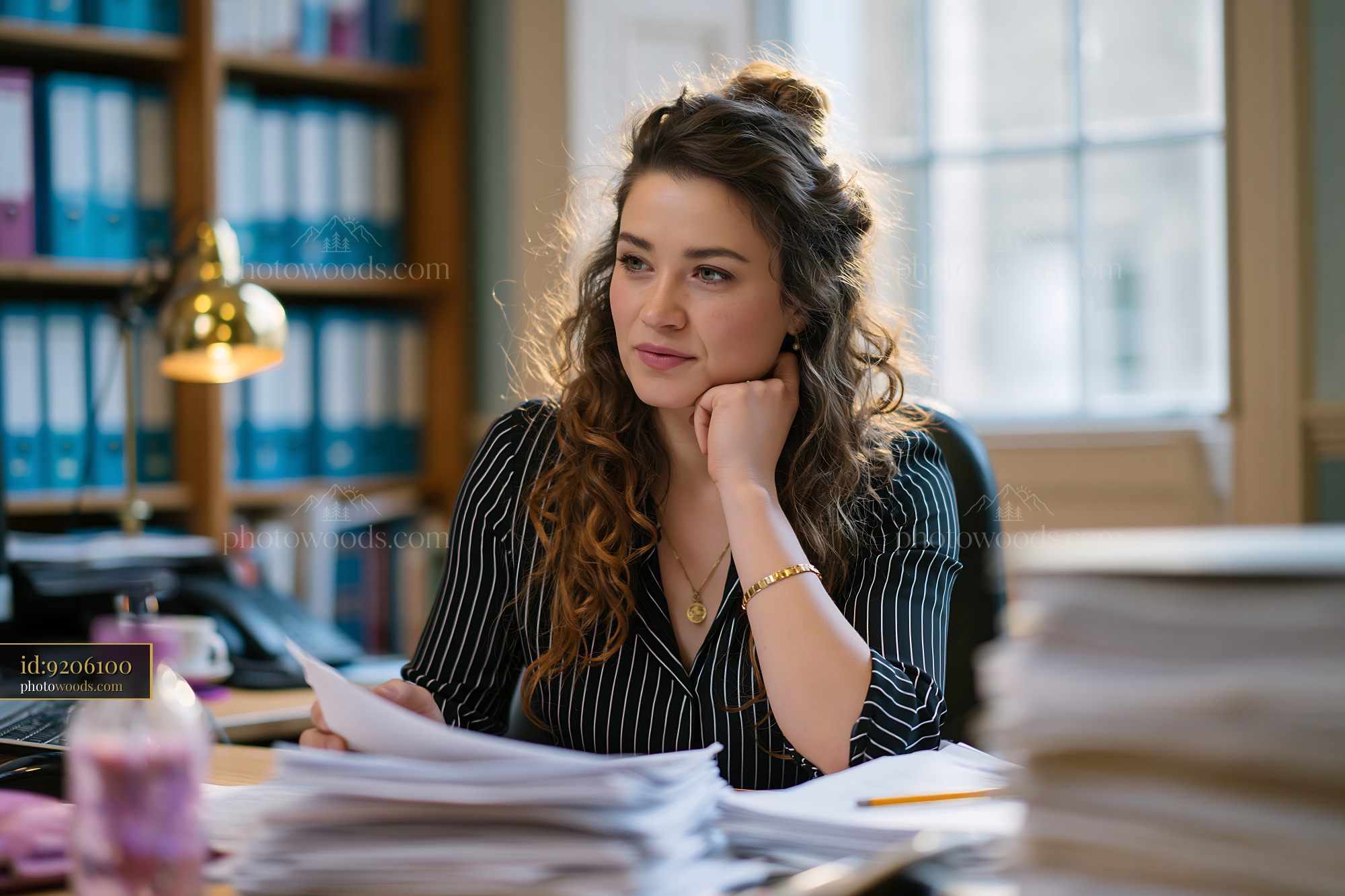 Manager Coordinating Tasks in Office With Papers and Documents