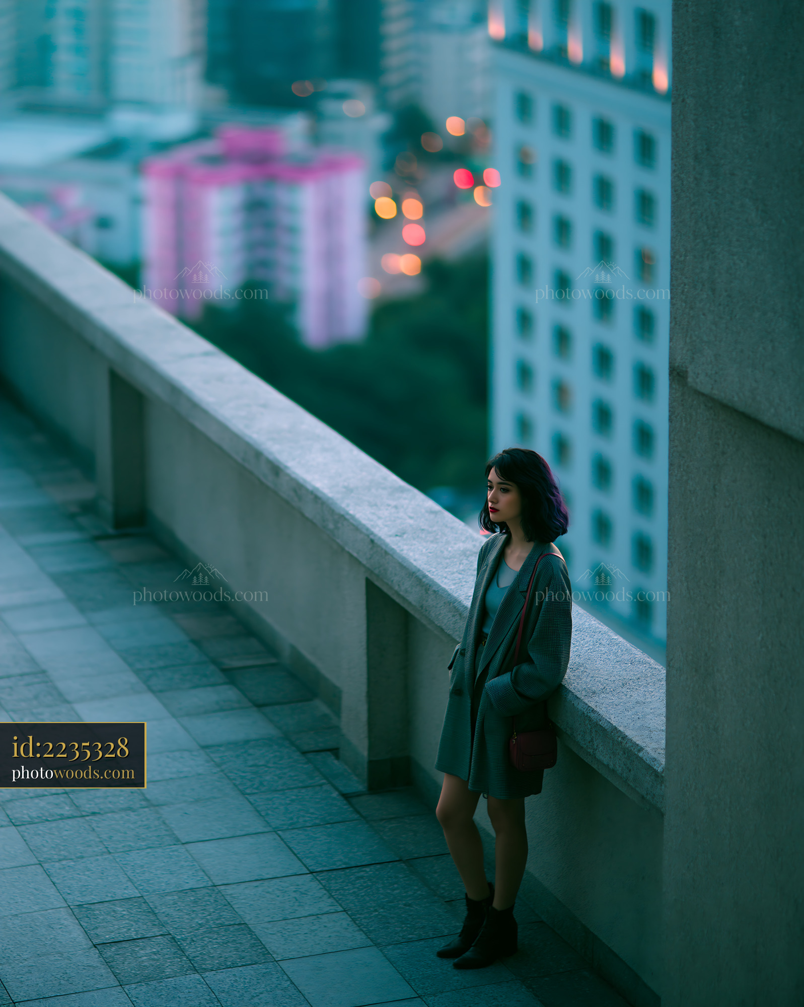 Woman in Oversized Blazer and Bike Shorts on a Rooftop at Night