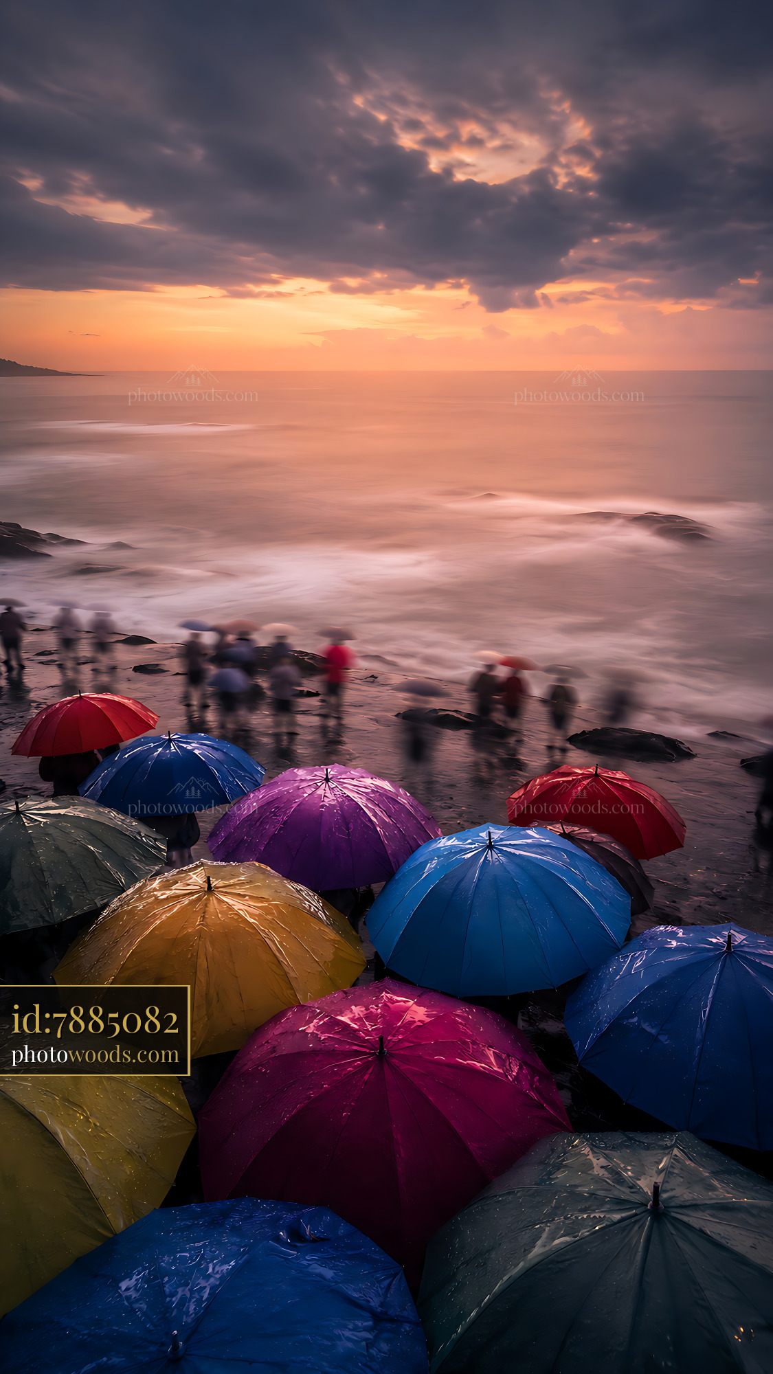 Colorful Umbrellas Gather at the Beach Under Cloudy Sky