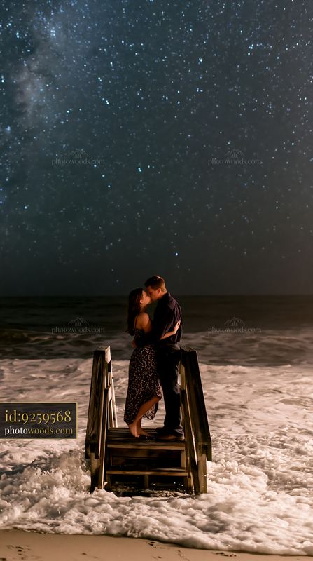 Romantic moment by the ocean under a starry sky