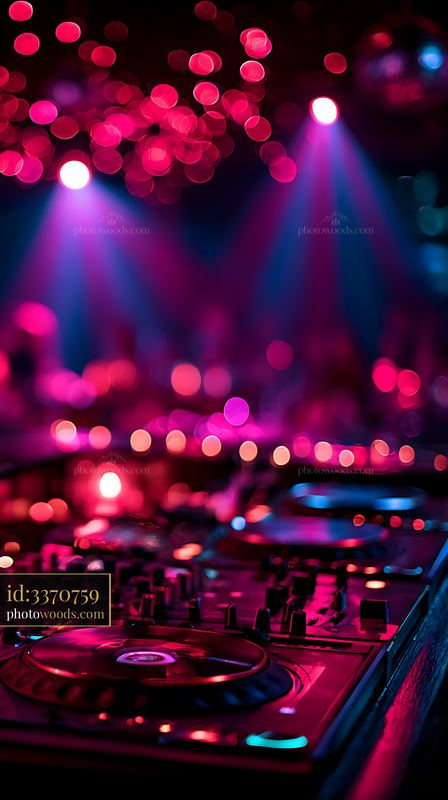 Dance floor with DJ equipment under colorful lights