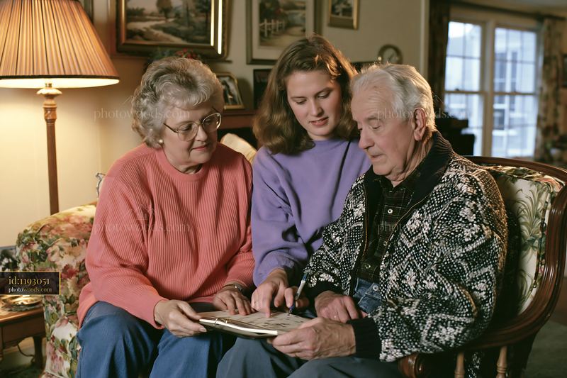 Family visiting a Parkinson's patient at home and sharing memories