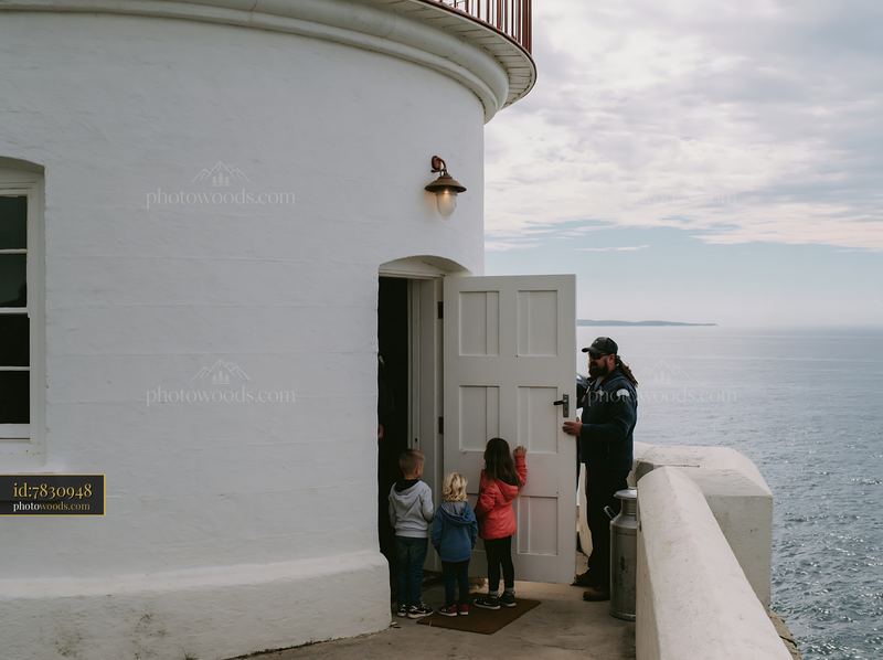 Lighthouse family sightseeing destination with children and guide