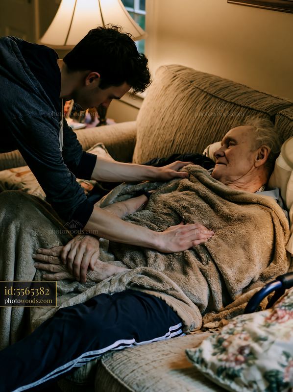 Family giving care to a Parkinson's patient at home setting