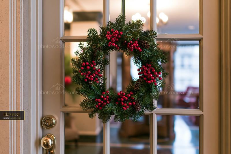 Christmas wreath hanging on an apartment door
