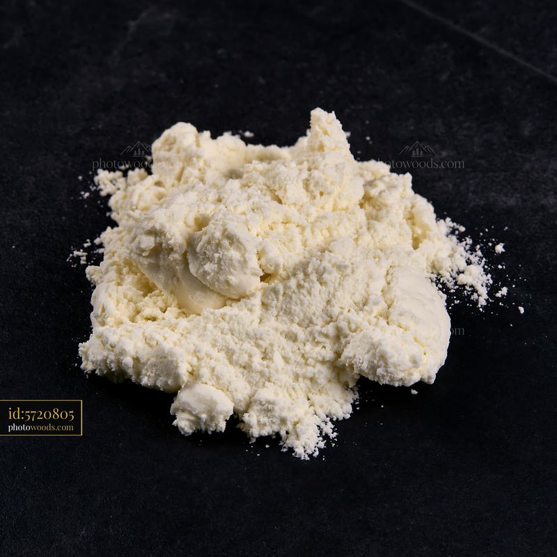Cream dose with matte texture on a dark surface
