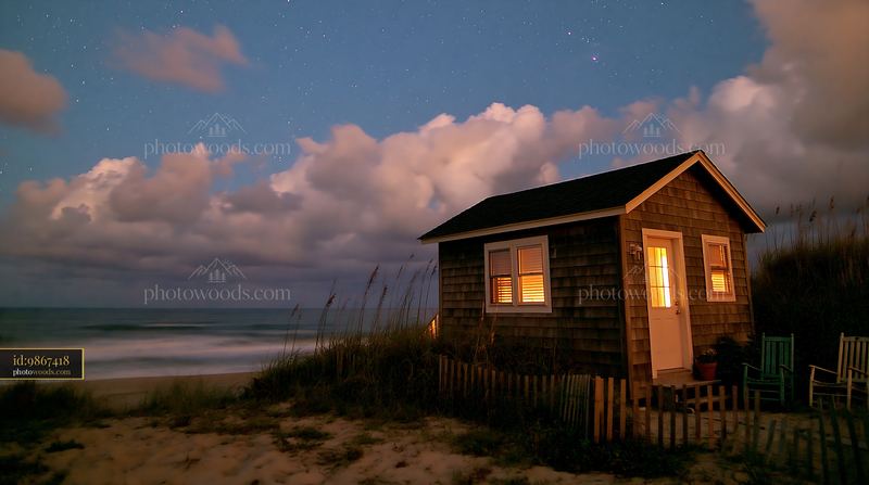 Beach house under stars near the ocean