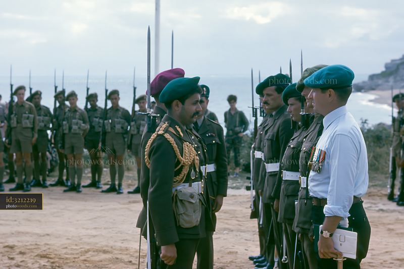 Soldier receiving medal in military ceremony by the ocean