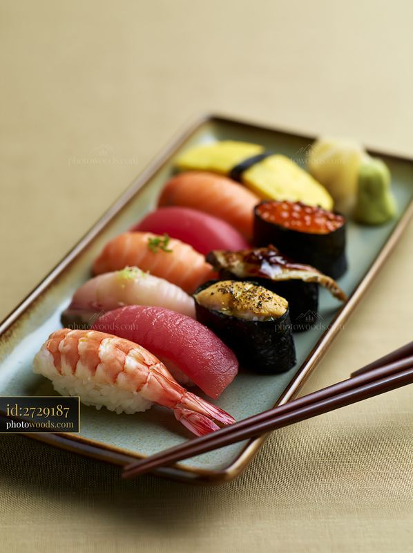 Sushi platter with negative space arranged on a simple background
