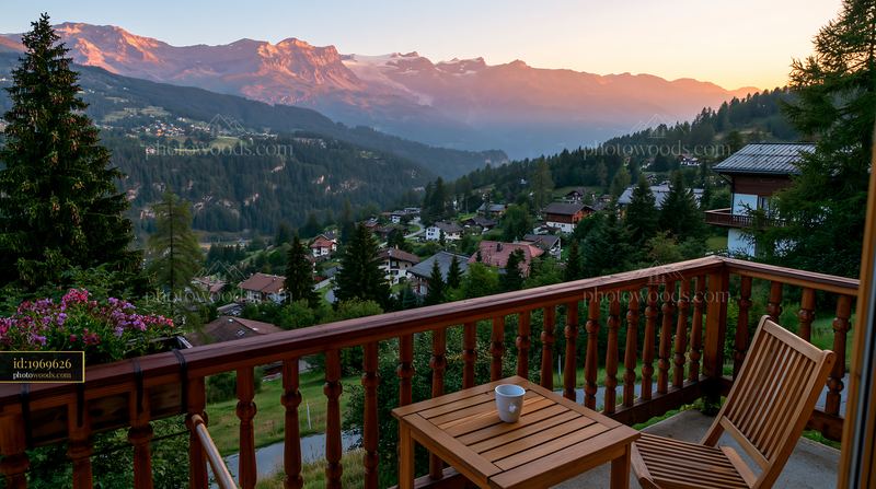 Scenic balcony view at a Swiss mountain hotel during sunset
