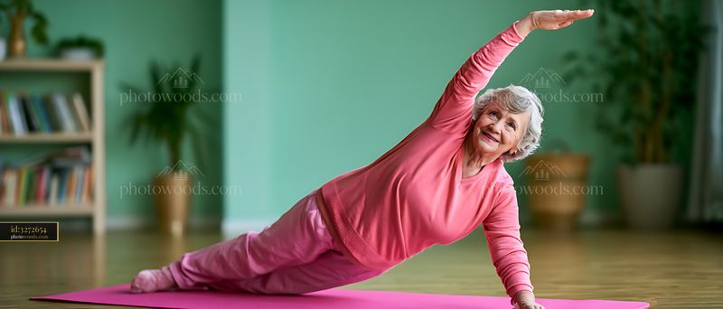 Elderly woman practicing yoga on a mat in a bright room