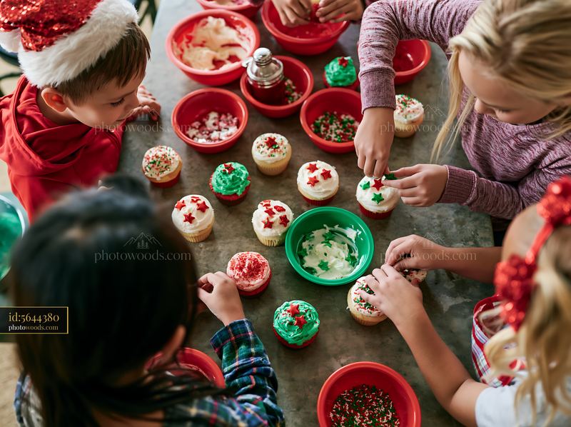 Children Decorating Christmas Cupcakes Together