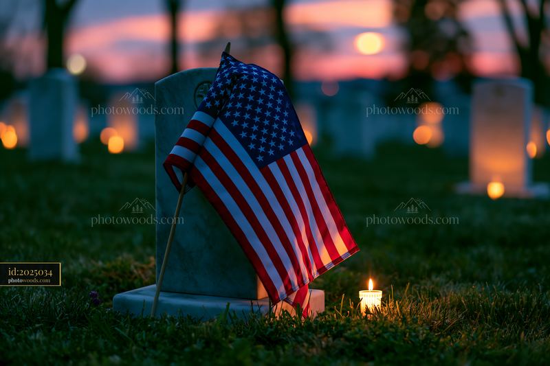 Veterans cemetery under a clear night sky with candlelight