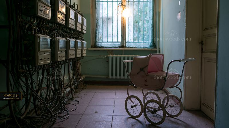 Old Baby Carriage in a Dark Hallway With Tangled Electrical Meters