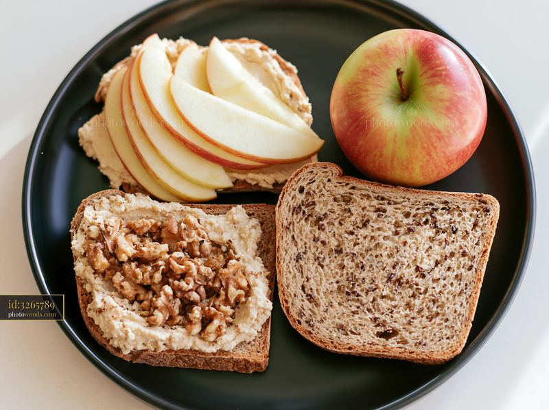 Healthy breakfast plate with hummus and fruits