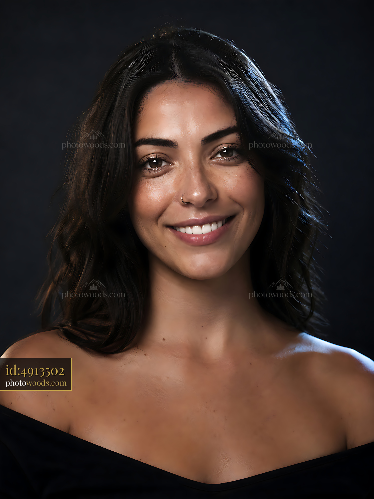 Woman With Dark Hair Smiling Softly in a Studio Setting