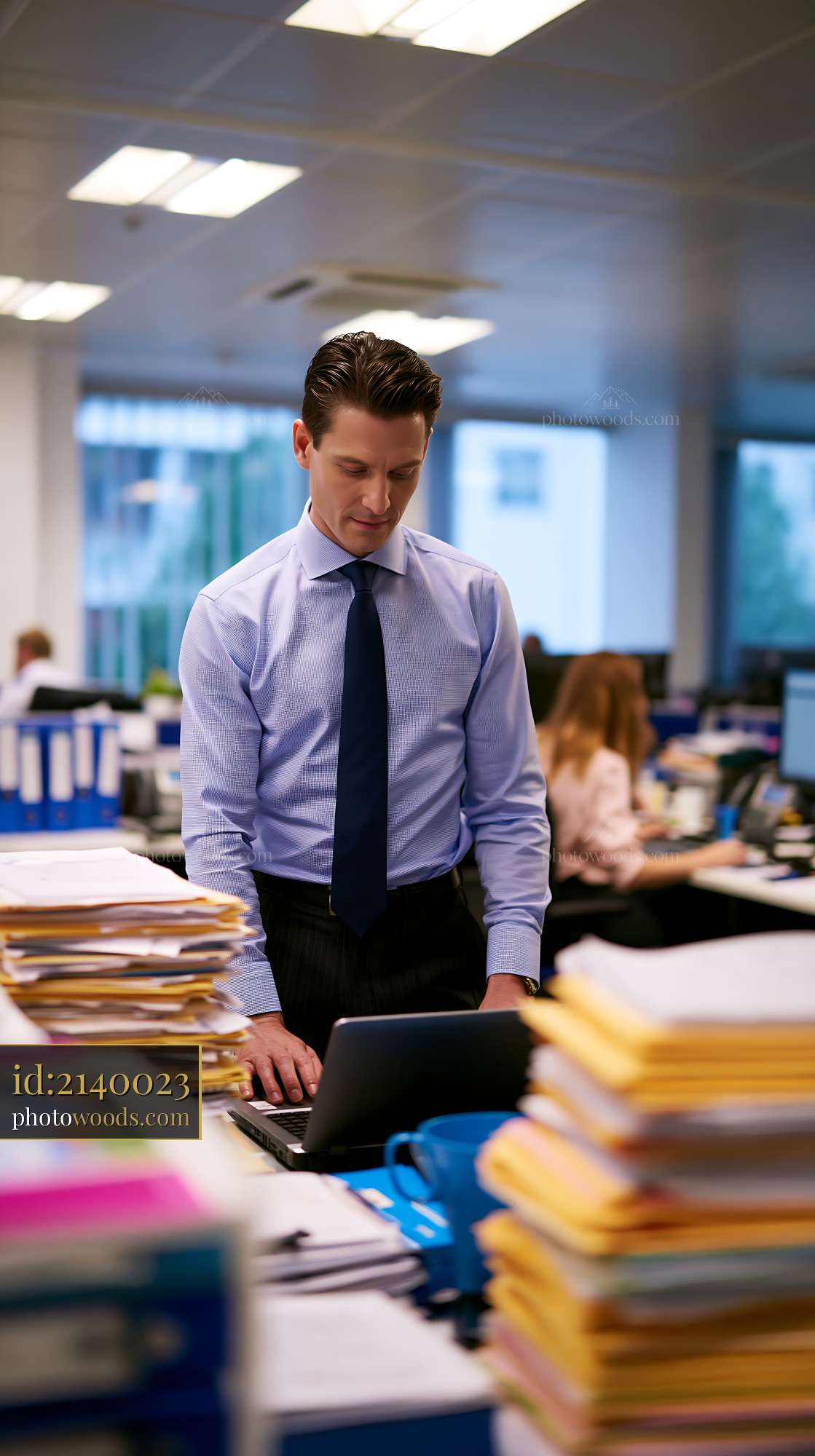 Compliance Officer Reviewing Documents in Modern Office Setting
