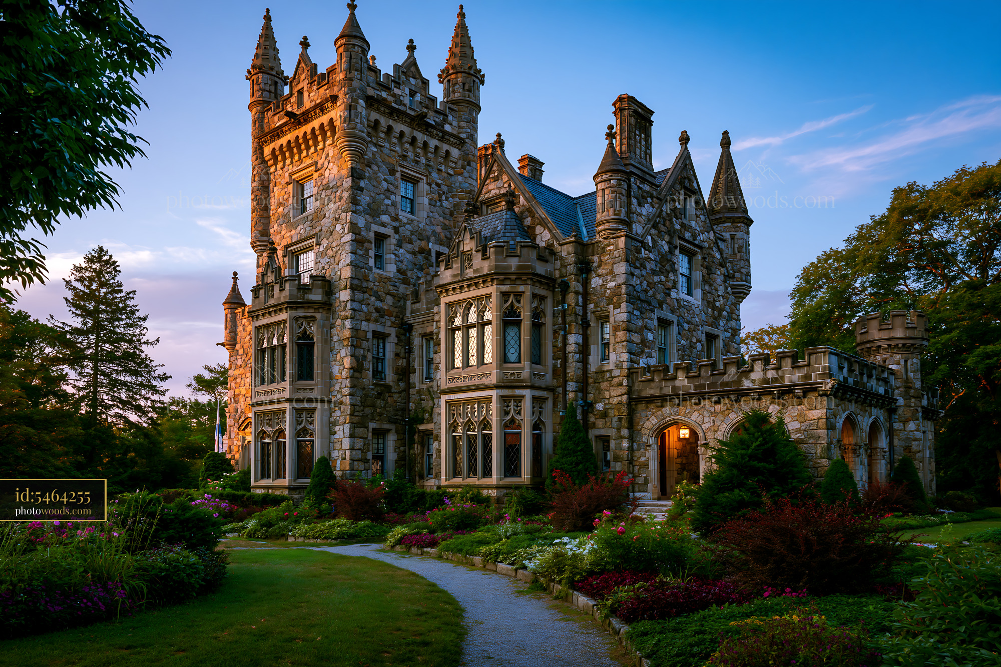 Historic Stone Castle at Sunset in a Landscaped Garden