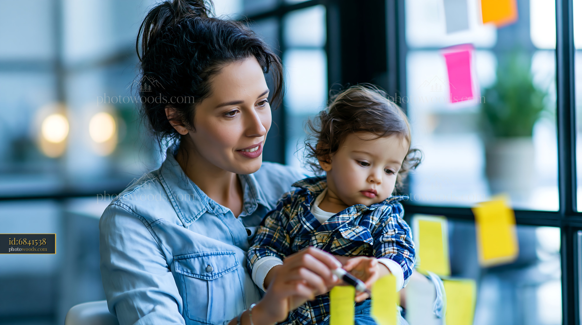 Working Mother Engages With Toddler While Brainstorming at Home