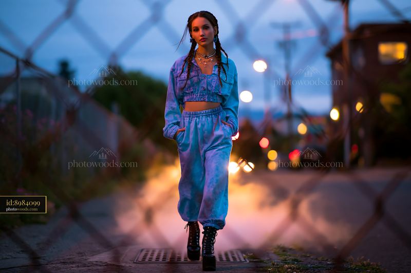 Model With Braided Hair Wearing Acid Wash Outfit on Street at Night