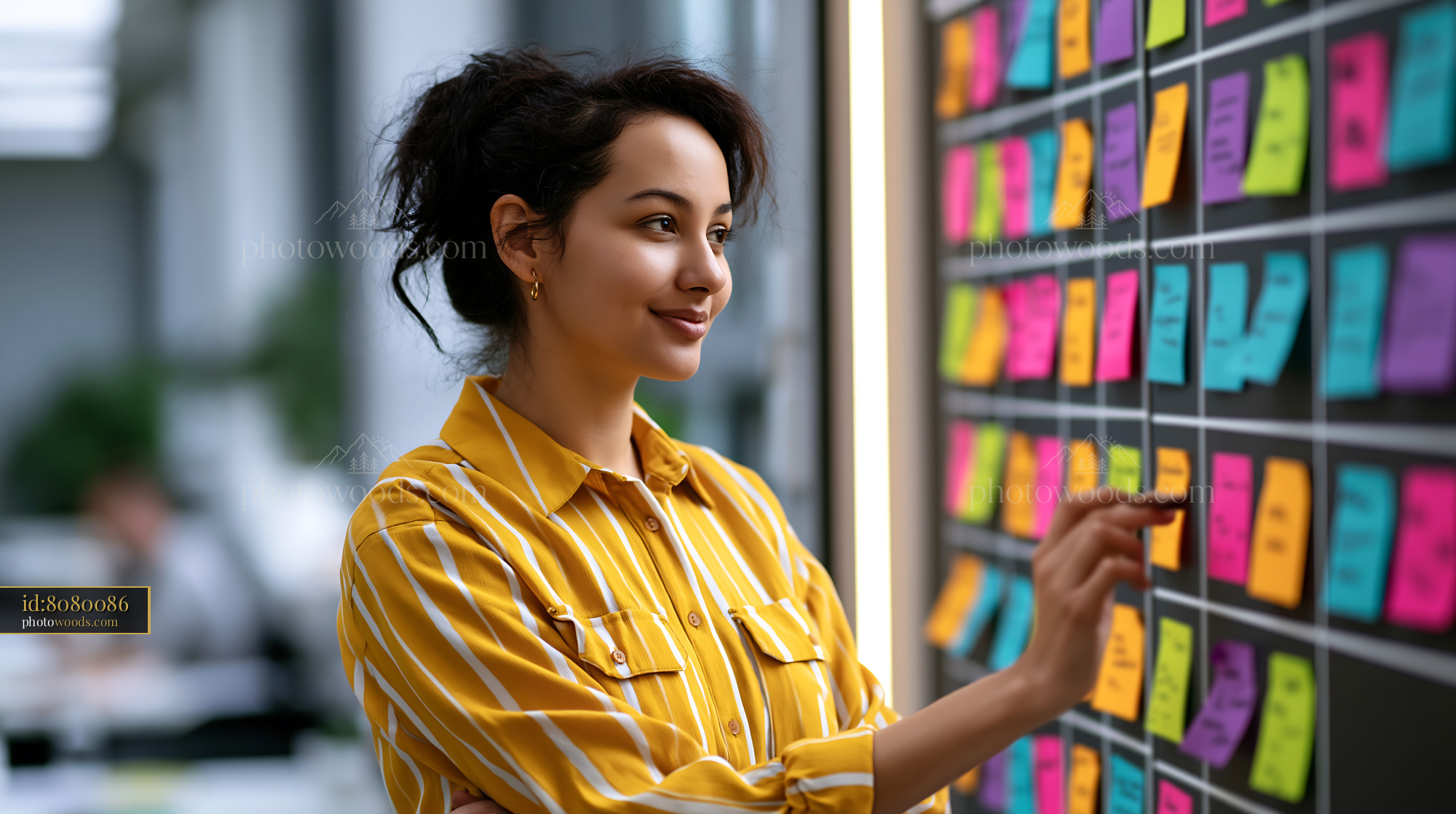 Manager Coordinating Tasks Using Sticky Notes in Office Setting