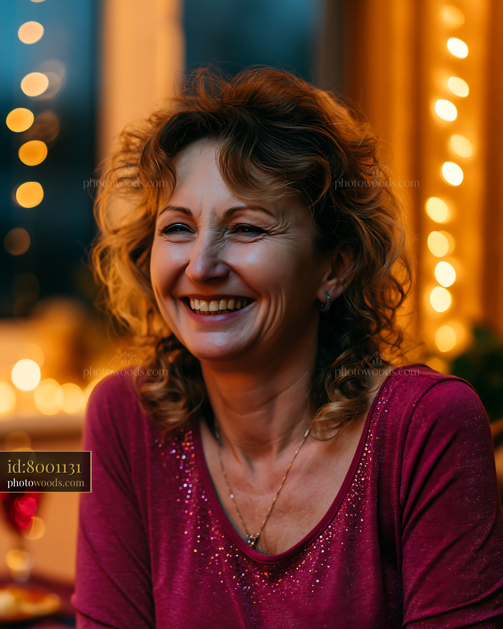 Woman Smiling in Cozy Indoor Setting With Warm Lights