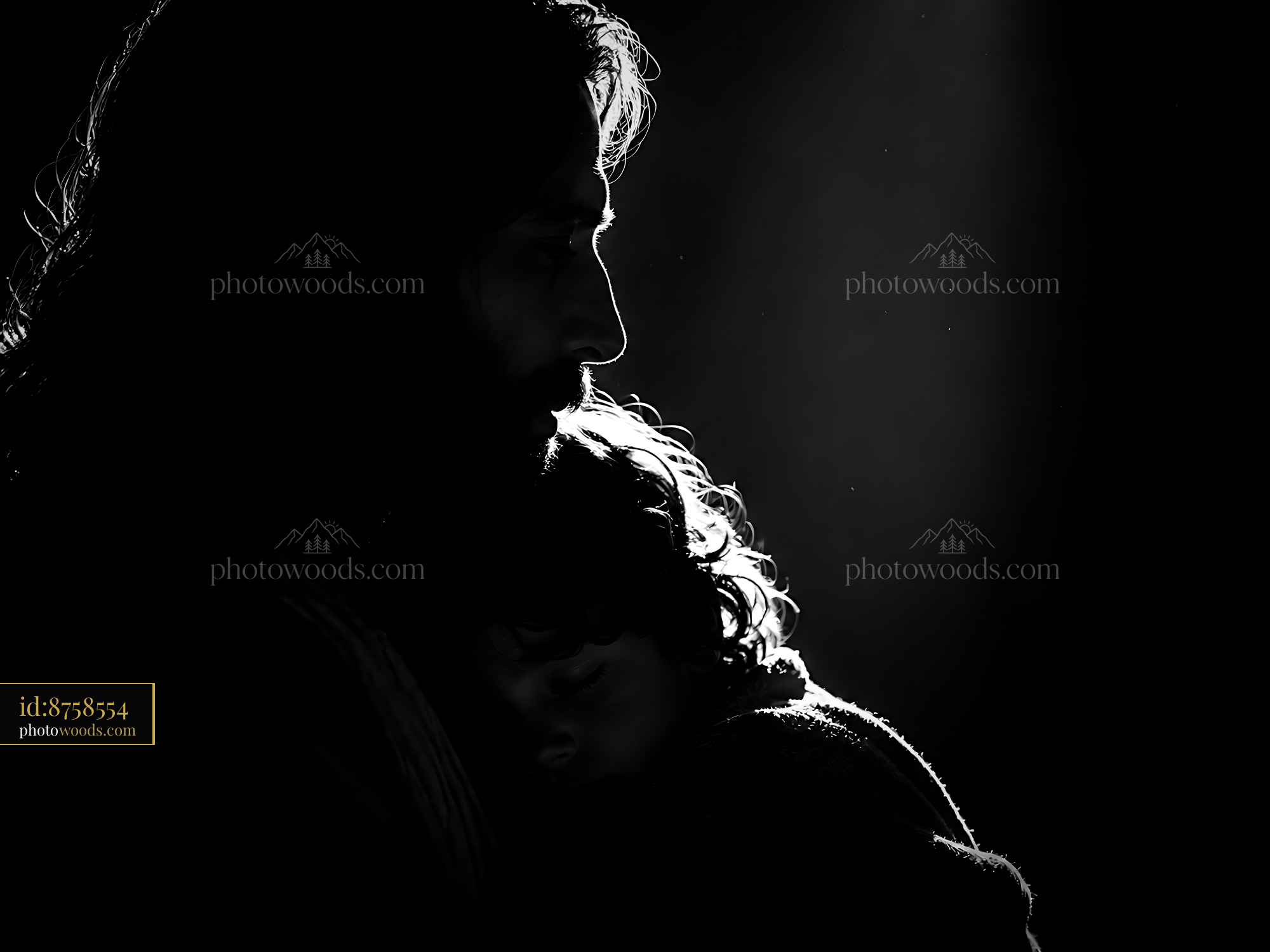 Father Holds Child Close in Dark Room With Gentle Light