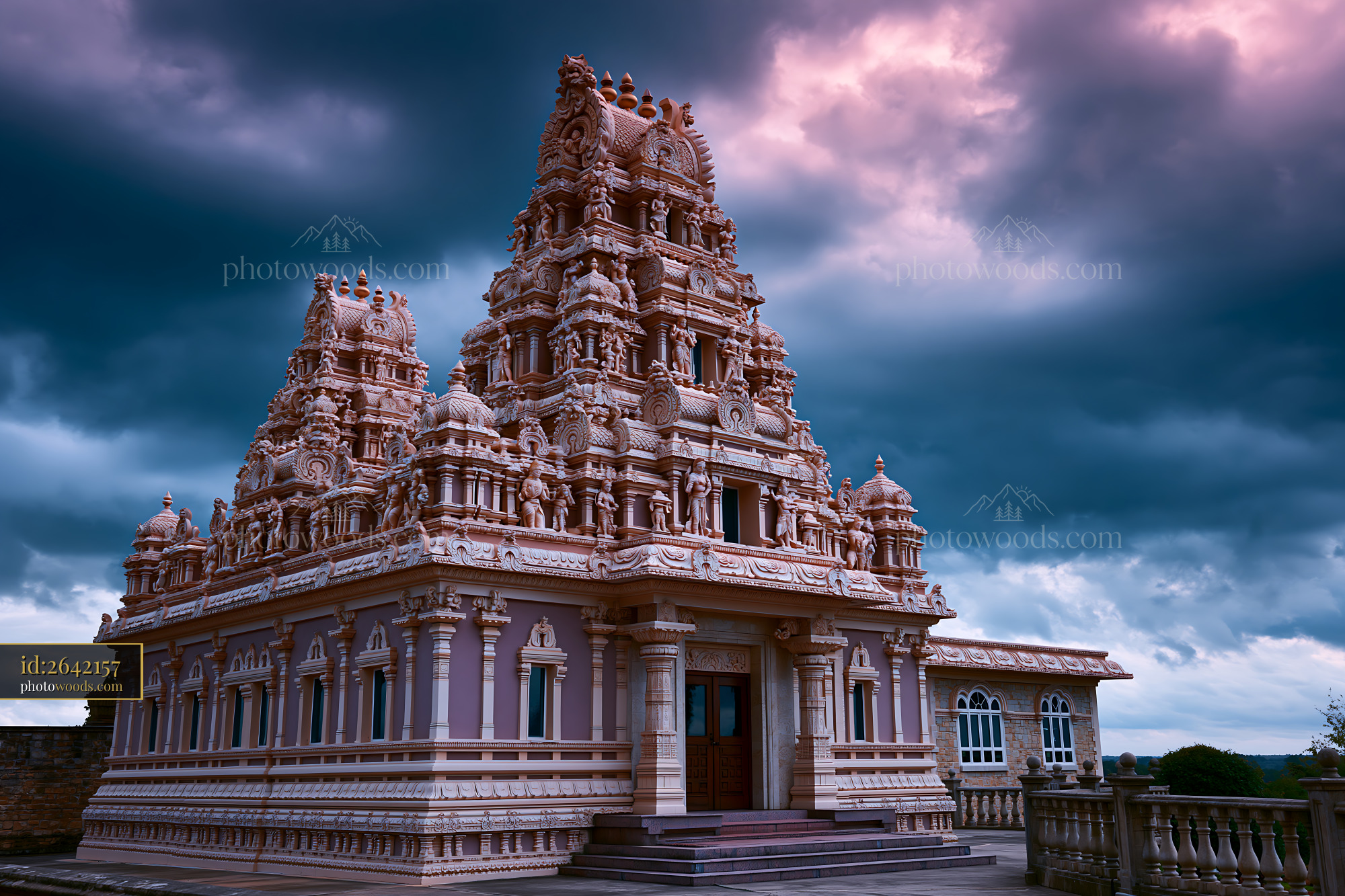 Hindu temple with intricate architecture under cloudy sky