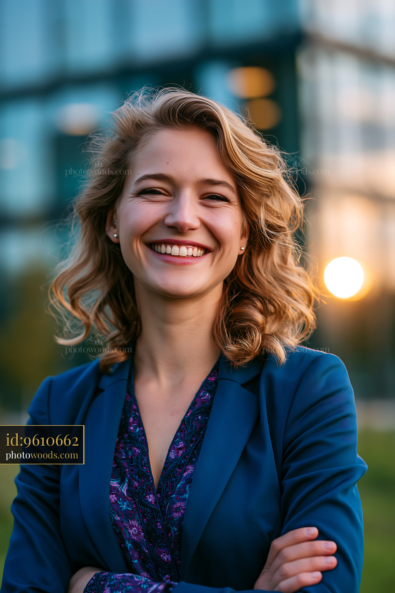 Woman Smiles Outdoors in Business Attire During Sunset