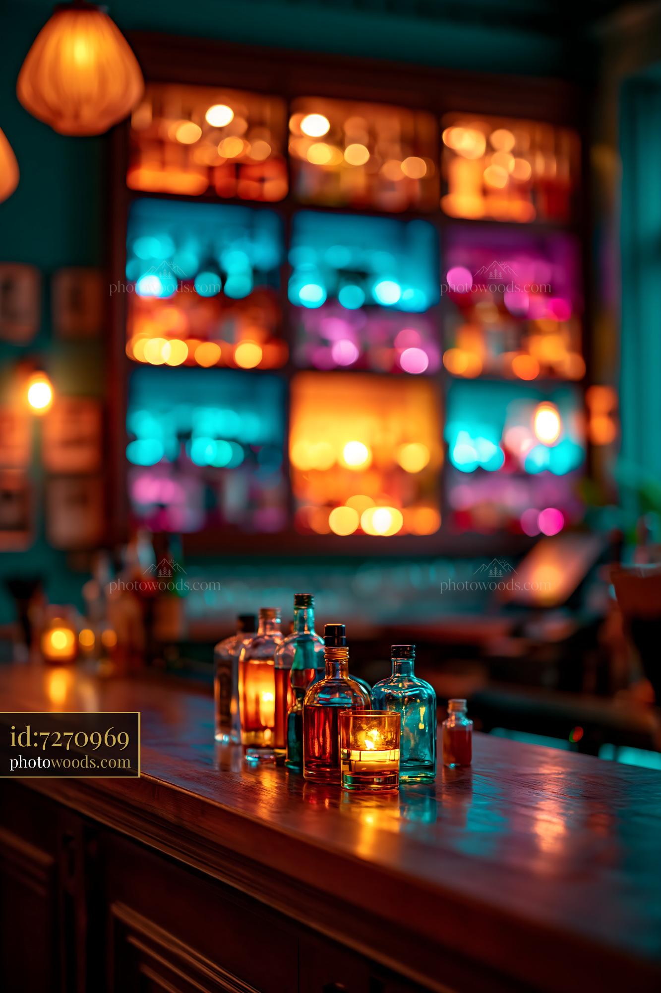 Glass Bottles on Bar With Colorful Lights in Background