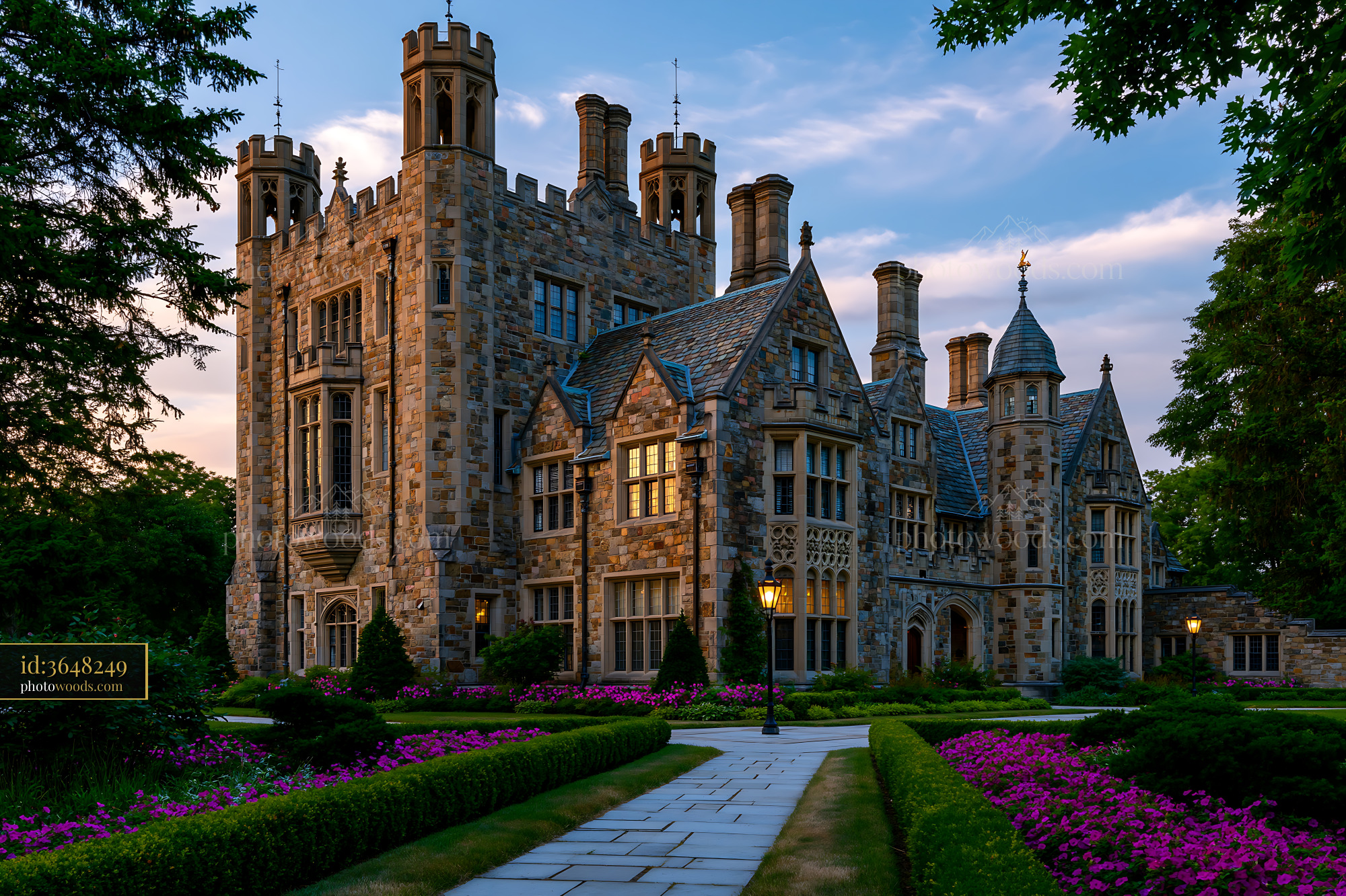 Historic Stone Castle With Flowers and Pathway in the Evening