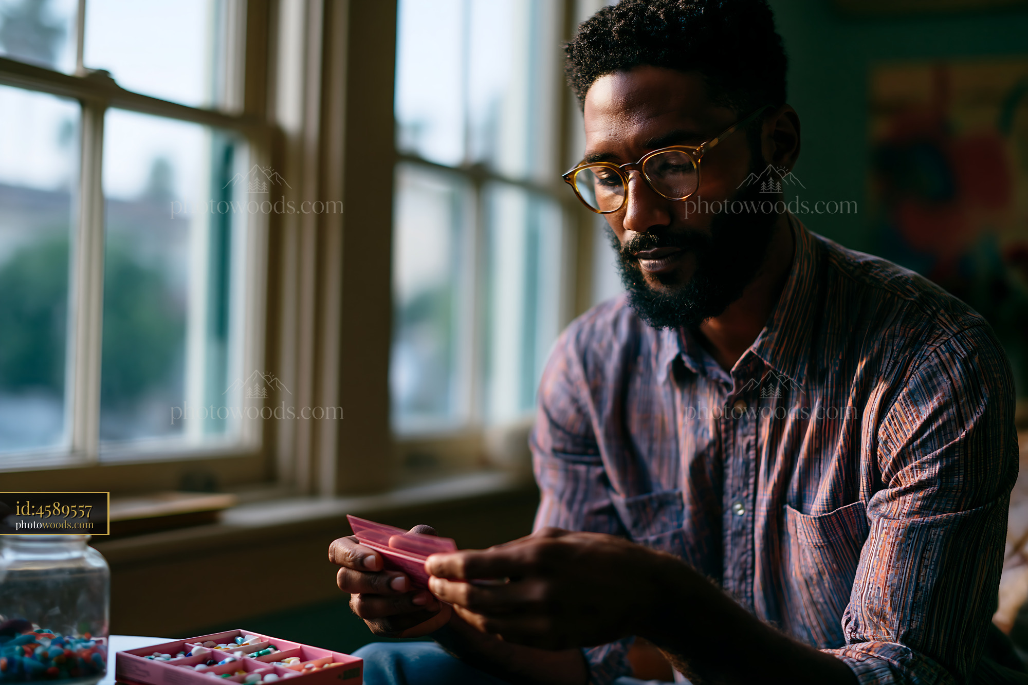 Man Sorting Medication at a Preventive Health Checkup Indoors