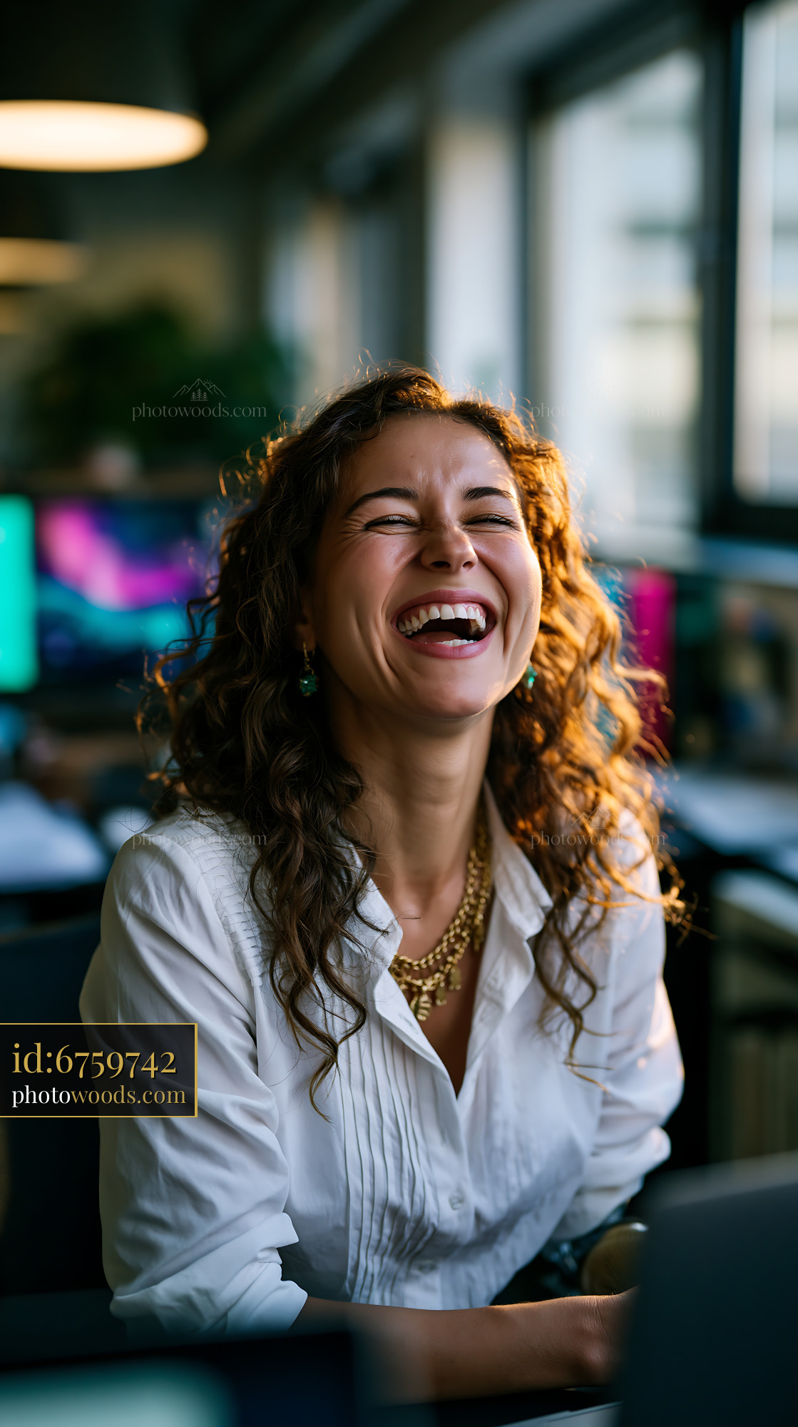 Laughing Businesswoman With a Prosthetic Arm in Modern Office