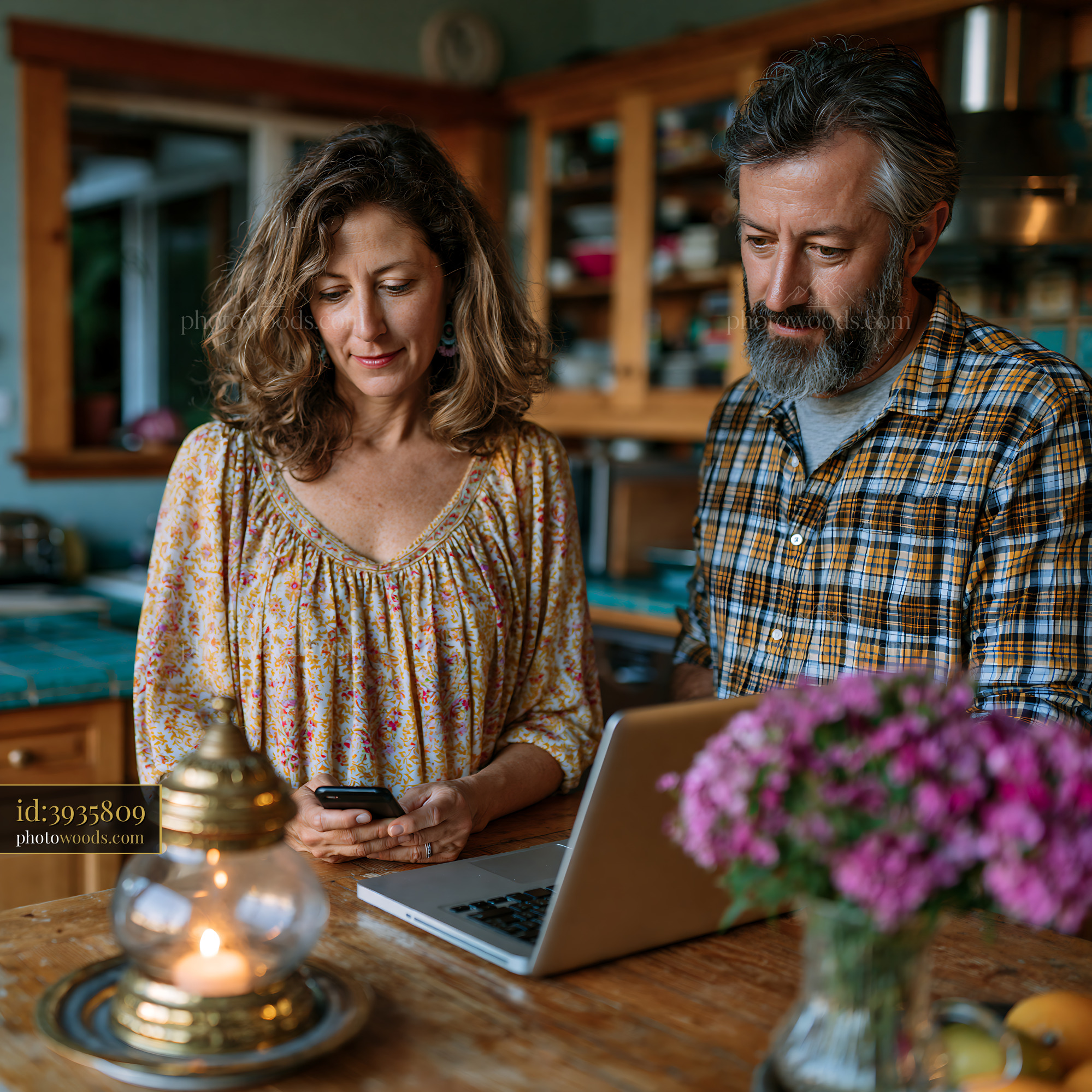 Co-parents Coordinating Shared Calendar in Home Kitchen Setting