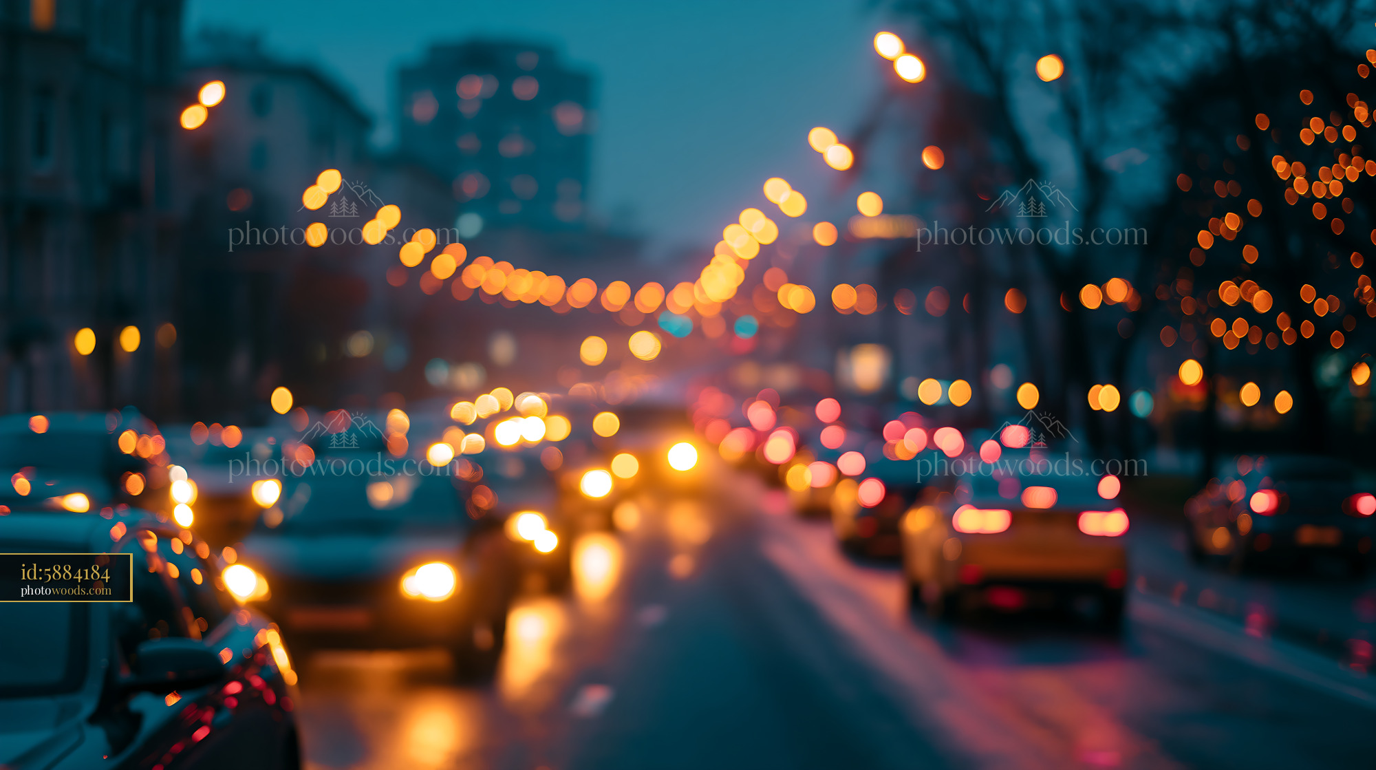 Traffic Flows Through a City Street at Night With Blurred Lights