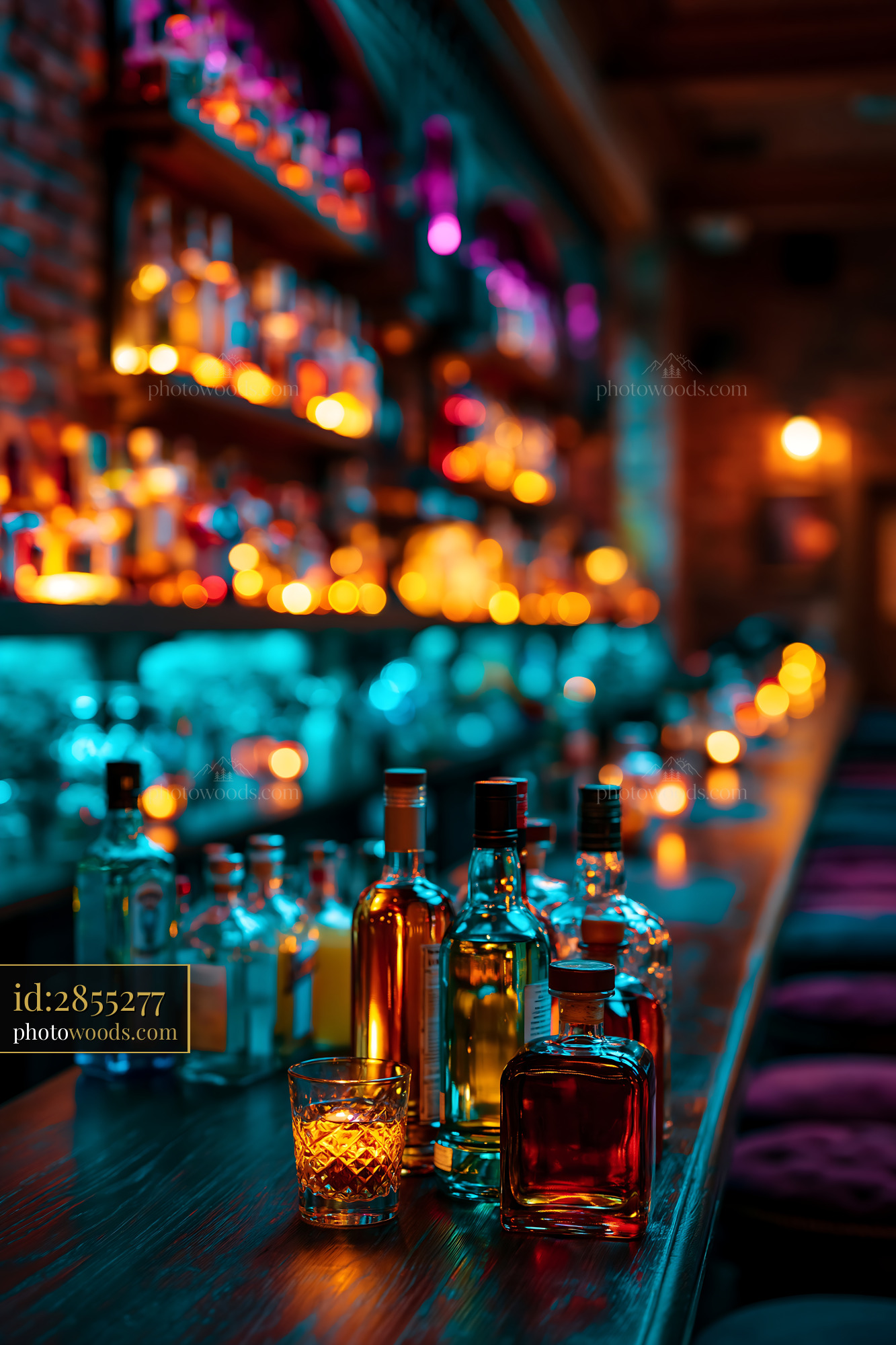 Bottles of Whiskey and Rum on a Bar Countertop at Night