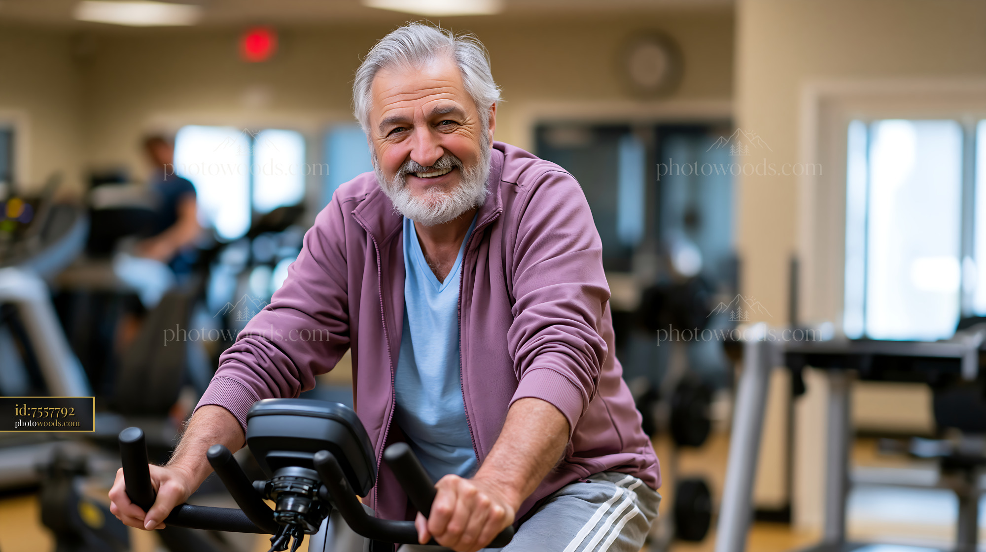 Senior Man Training on E-Bike in Gym Setting