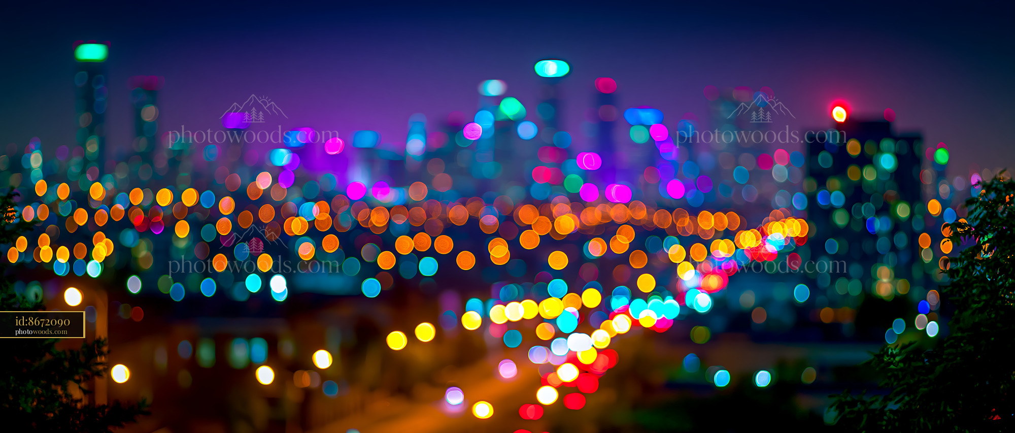 City Skyline With Colorful Lights Glowing at Night