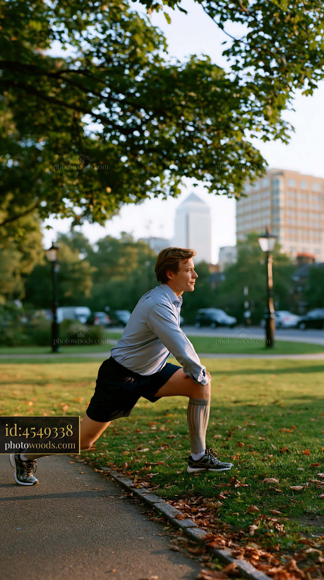 Office Worker Stretching in Park During Sunset
