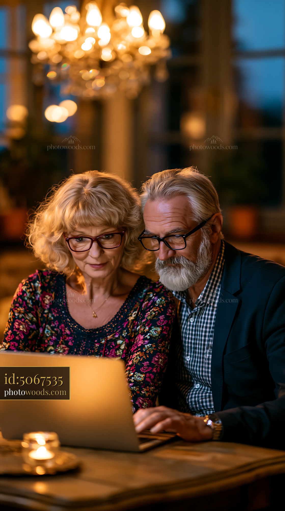 Elderly Couple Reviewing Documents Together at Home in Evening